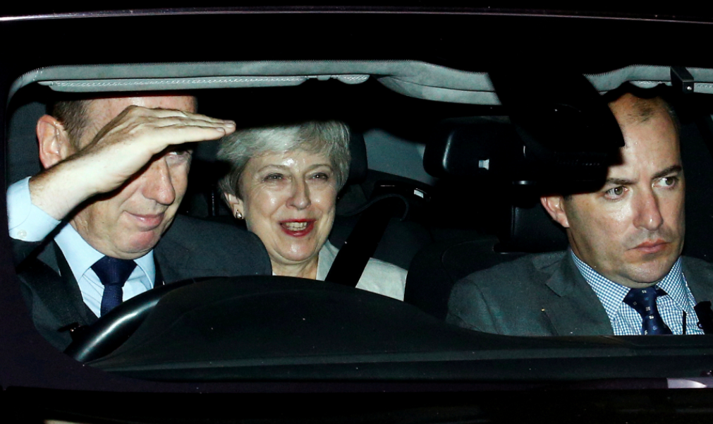 Theresa May left Parliament with a smile on her face following Boris Johnson's defeat (Reuters)