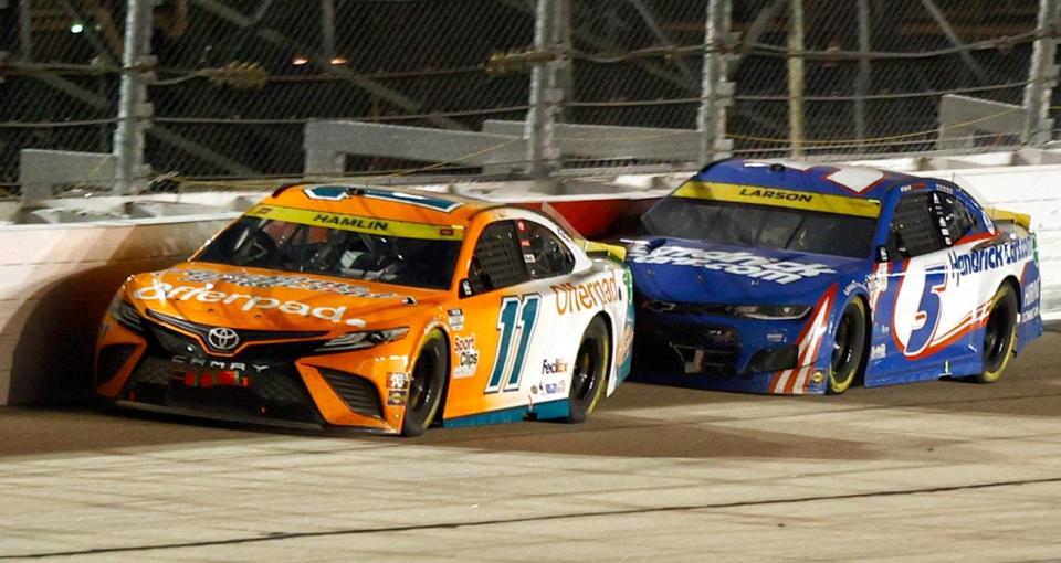 Denny Hamlin leads Kyle Larson in a 2021 NASCAR Cup Series race at Darlington.