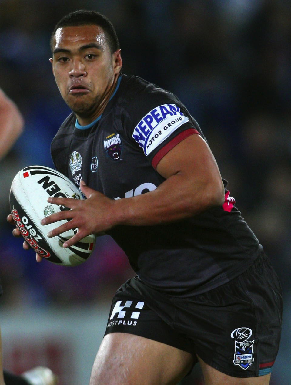 Former NRL star Masada Iosefa runs with the ball during the round 19 NRL match between the Gold Coast Titans and the Penrith Panthers in 2008 at the Gold Coast, Australia