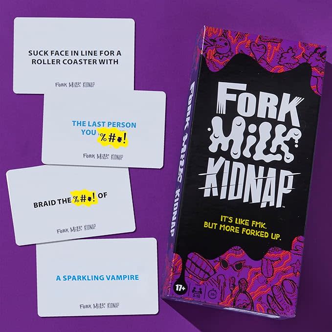 purple and black fork, milk, kidnap board game for adults box next to cards