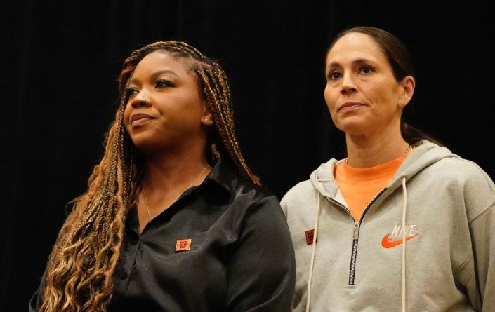 Sue Bird (right) stands alongside Cherelle Griner during a press conference.