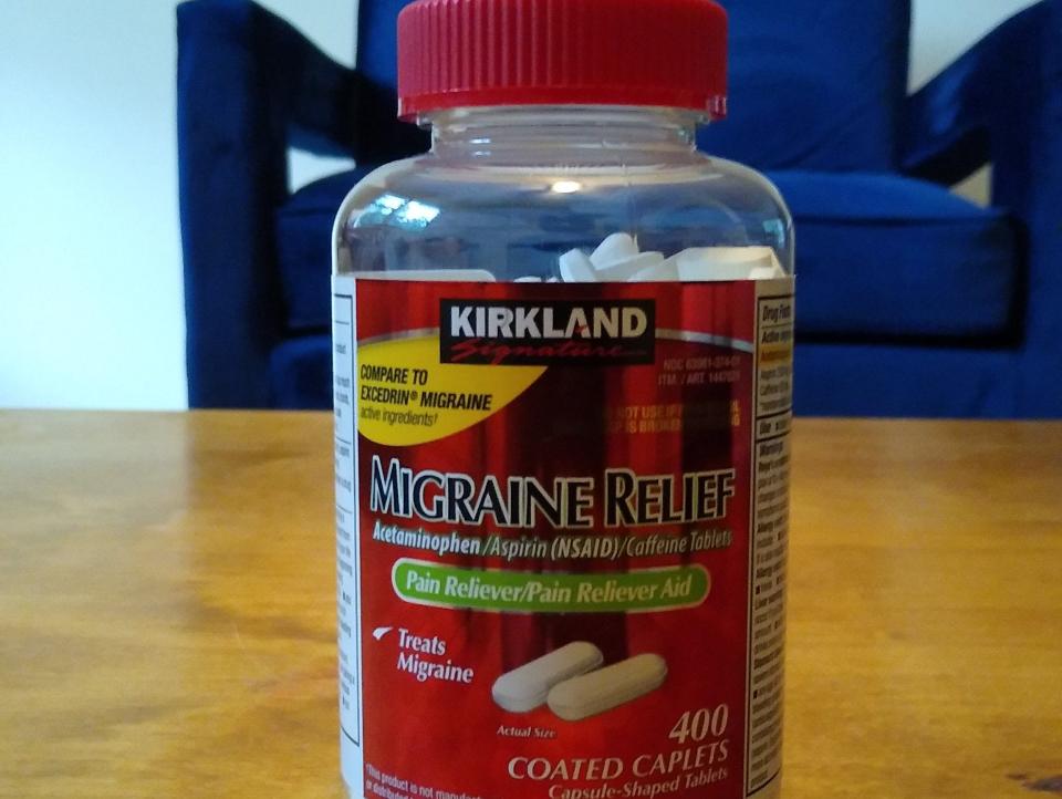 Red and clear bottle of migraine relief tablets from Costco