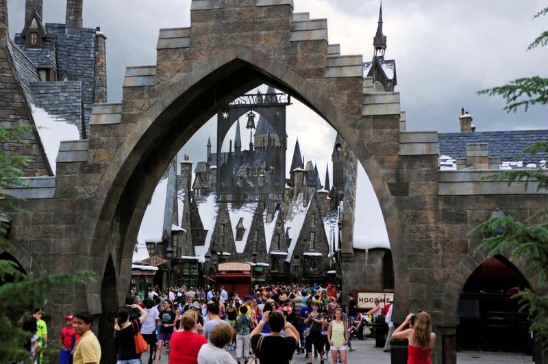 FILE PHOTO: Guests walk in and out of Hogsmeade Village during a media preview for The Wizarding World of Harry Potter-Diagon Alley at the Universal Orlando Resort in Orlando