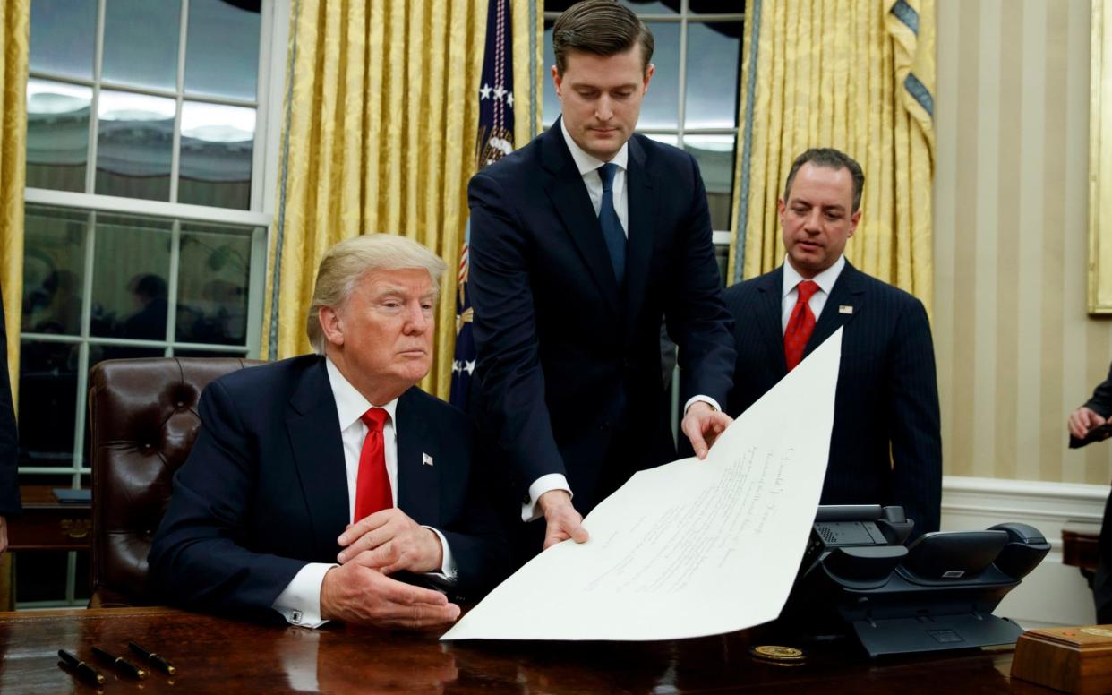 Rob Porter, centre, resigned over the allegations - AP