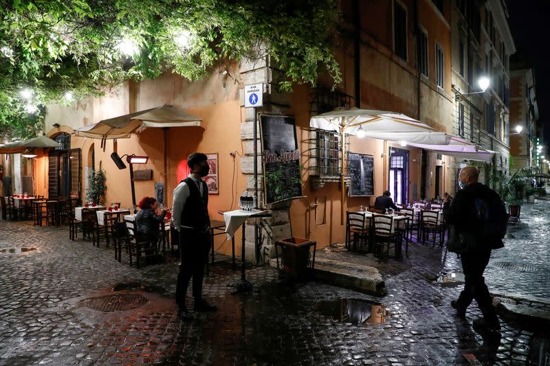 FILE PHOTO: Empty tables are seen outside a restaurant in Rome as the country tightens regulations in an effort to control rising COVID-19 infections