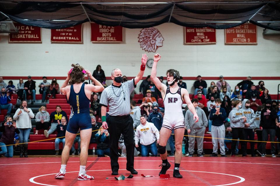 New Paltz's Justin Coiteux, right, wins his match in the 138-pound weight class during the Section 9 Division 2 finals at Liberty High School on Sunday, February 13, 2022.