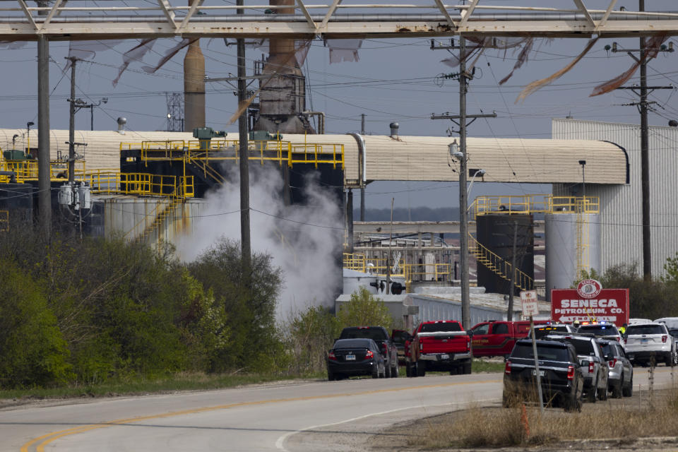 Emergency crews respond to an explosion at the Seneca Petroleum Company in Lemont, Ill., Tuesday, April 25, 2023. An explosion at the suburban Chicago petroleum plant killed one person and injured a second Tuesday morning, authorities said. (Eileen T. Meslar/Chicago Tribune via AP)