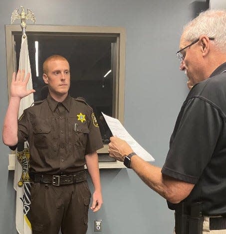 Josh Olney takes the oath in August from Sheriff John Pollack to become Branch County's newest deputy. The former corrections officer fills the last vacancy until January's new hires after retirements and promotions.