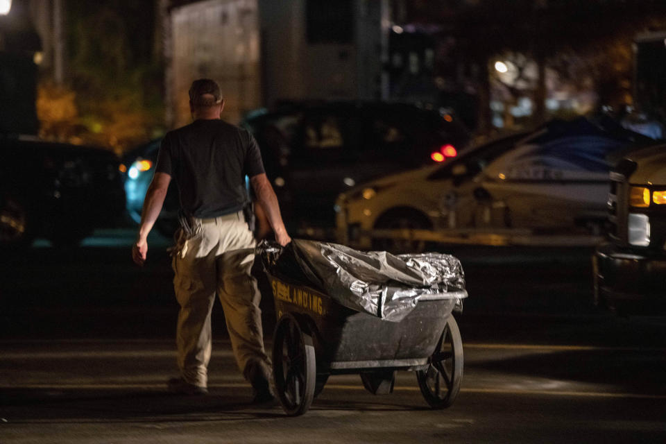 Authorities cart away evidence taken from the scuba boat Conception in Santa Barbara Harbor at the end of their second day searching for the remaining divers on Tuesday, Sept. 3, 2019, in Santa Barbara, Calif. High school students, a science teacher and his daughter, an adventurous marine biologist and a family of five celebrating a birthday are among those presumed to have died when fire tore through a scuba diving boat off the Southern California coast Monday, trapping dozens of sleeping people below deck. (AP Photo/Christian Monterrosa)