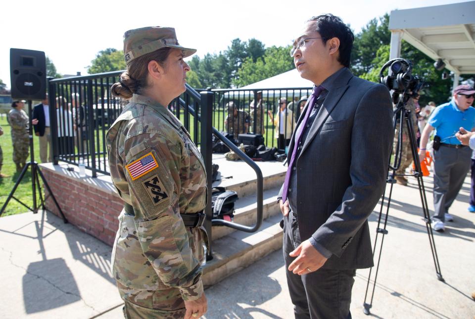 Maj. Gen. Kris A. Belanger talks with U.S. Rep. Andy Kim after a change of command ceremony of the 99th U.S. Army Reserve Command at Joint Base McGuire-Dix-Lakehurst. Aug. 11, 2023