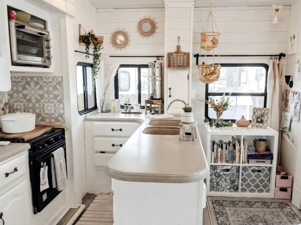 The all-white kitchen inside April Gilleland's RV