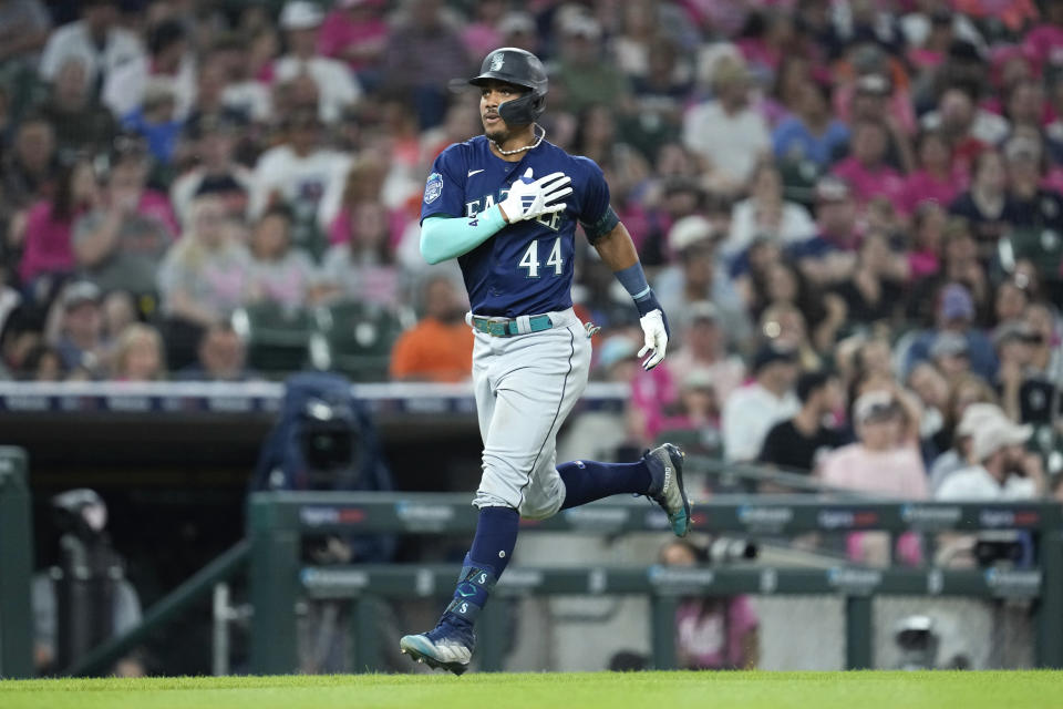 Seattle Mariners' Julio Rodriguez (44) rounds third base after hitting a two-run home run against the Detroit Tigers in the ninth inning of a baseball game, Friday, May 12, 2023, in Detroit. (AP Photo/Paul Sancya)