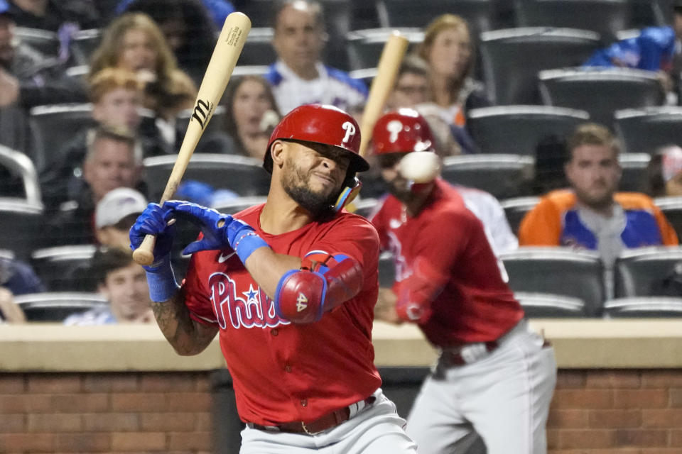 Philadelphia Phillies' Edmundo Sosa is hit by a pitch from New York Mets reliever Phil Bickford during the fifth inning of the second game of a baseball doubleheader, Saturday, Sept. 30, 2023, in New York. (AP Photo/Mary Altaffer)