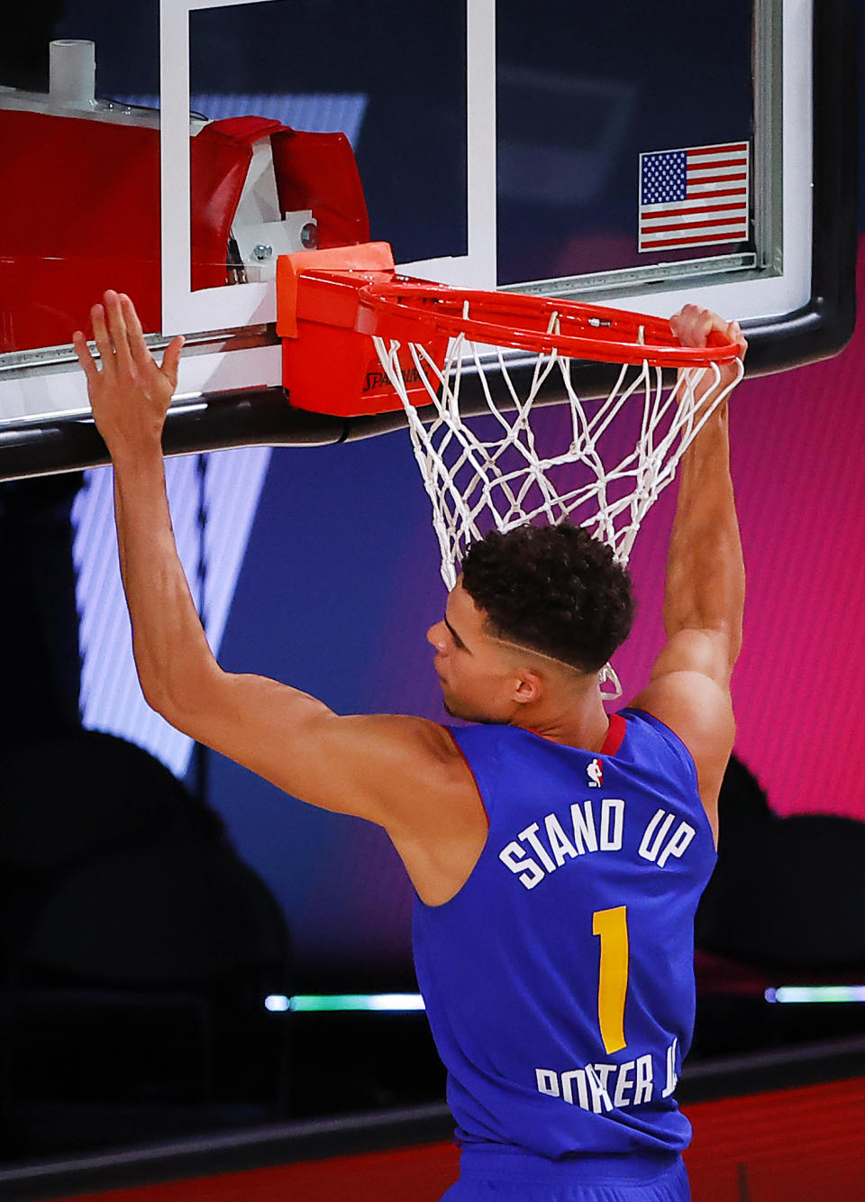 Denver Nuggets' Michael Porter Jr. slam-dunks during the third quarter of an NBA basketball game against the Utah Jazz, Saturday, Aug. 8, 2020, in Lake Buena Vista, Fla. (Kevin C. Cox/Pool Photo via AP)