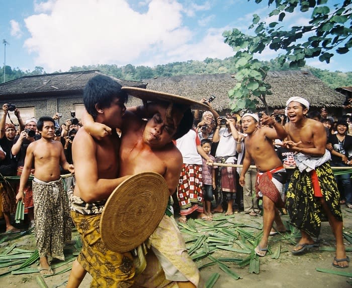 Gladiator of Tenganan village: The village holds an annual festival called the Usaba Sambah, which normally takes place in May.During the festival, you can watch the village's menfolk battling each other with pandan leaves in a match-making ritual. (