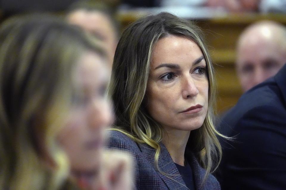 Karen Read listens to testimony during her trial, Friday, May 3, 2024, in Dedham, Mass. Read is accused of backing her SUV into her Boston Police officer boyfriend, John O'Keefe, and leaving him to die in a blizzard in Canton, Mass., in 2022. (AP Photo/Michael Dwyer)