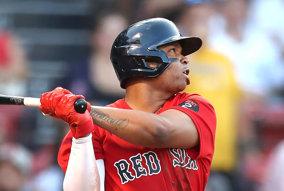 Boston Red Sox third baseman Rafael Devers watches his 1st inning double careen off the Green Monster during an MLB game.