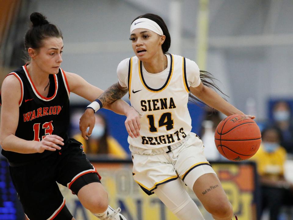 Sha'Kyia Parker of Siena Heights drives the ball during last season against Indiana Tech. She scored a career-high 31 points Saturday.
