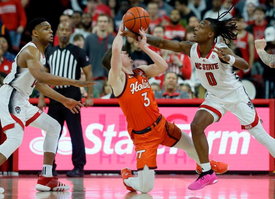 N.C. State’s DJ Horne causes Virginia Tech’s Sean Pedulla to turn the ball over during the second half of the Wolfpack’s 84-78 loss on Saturday, Jan. 20, 2024, at PNC Arena in Raleigh, N.C.