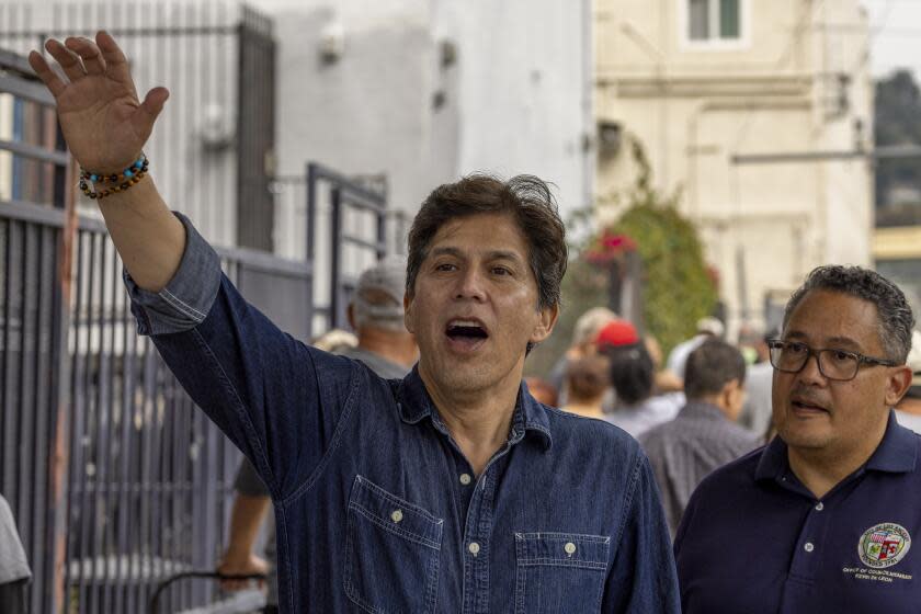 Los Angeles, CA - September 21: Embattled 14th District Los Angeles City Council member Kevin de Leon waves to a person as hundreds of needy people attend his food distribution outside his council office in Los Angeles Thursday, Sept. 21, 2023. Kevin de Leon, who announced his reelection bid, was caught in racist recording last fall which was followed by a large outpouring of community members, colleagues, local leaders, Gov. Newsom and President Biden asking him to resign. (Allen J. Schaben / Los Angeles Times)