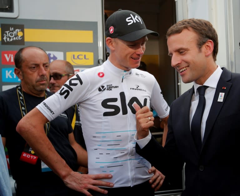 French President Emmanuel Macron (R) talks to overall leader, Britain's Chris Froome, after the 183km 17th stage of the 104th edition of the Tour de France cycling race, in Serre-Chevalier, on July 19, 2017