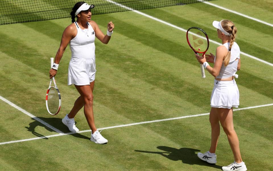 Heather Watson of Great Britain (L) and partner Harriet Dart of Great Britain interact against Lyudmyla Kichenok of Ukraine and Jelena Ostapenko of Latvia during their Women's Doubles Third Round match on day eight of The Championships Wimbledon 2022 at All England Lawn Tennis and Croquet Club on July 04, 2022 in London, England - Clive Brunskill/Getty Images Europe