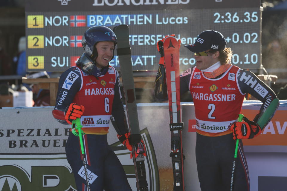 From left, second placed Norway's Henrik Kristoffersen and the winner Norway's Lucas Braathen talk after an alpine ski, men's World Cup giant slalom, in Alta Badia, Italy, Sunday, Dec. 18, 2022. (AP Photo/Alessandro Trovati)