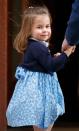 <p>Princess Charlotte has perfected the over-the-shoulder pose, as she looks back at the cameras before entering St. Mary's Hospital to visit her newborn baby brother, Prince Louis. </p>