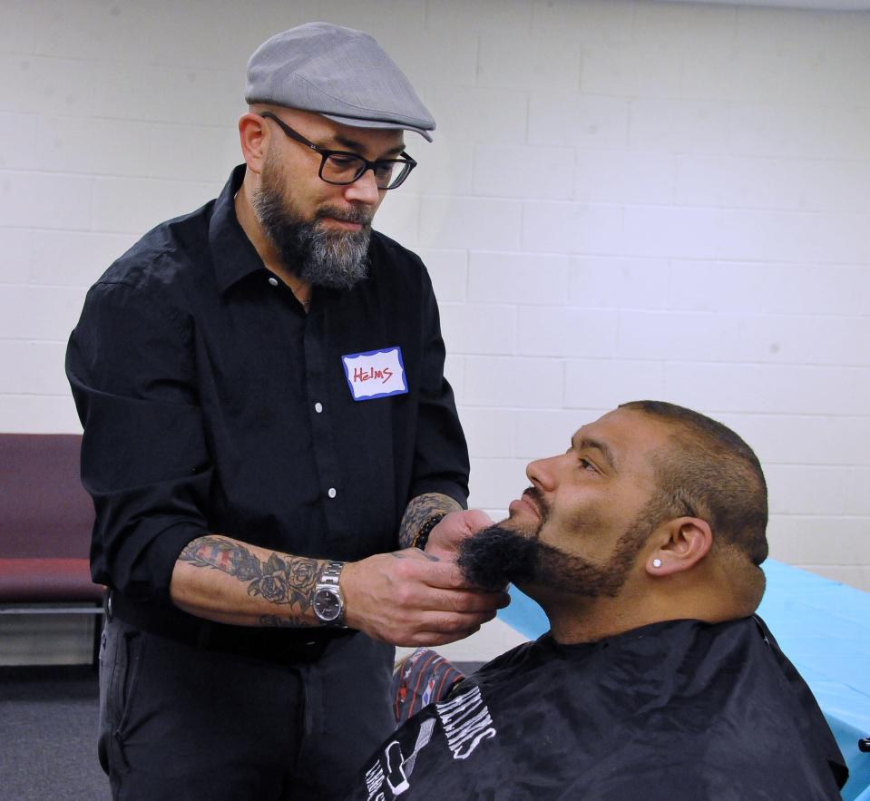 Ryan Helms gives Luke Trieber a haircut and a trim.