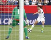 Jun 22, 2015; Edmonton, Alberta, CAN; United States forward Alex Morgan (13) scores a goal during the second half against the Colombia in the round of sixteen in the FIFA 2015 women's World Cup soccer tournament at Commonwealth Stadium. Mandatory Credit: Erich Schlegel-USA TODAY Sports -