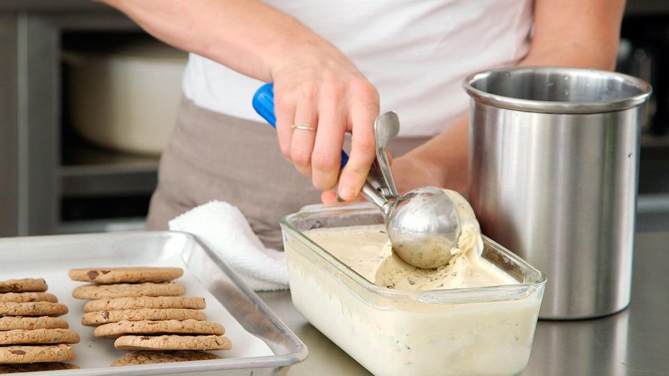 scooping homemade ice-cream from dish