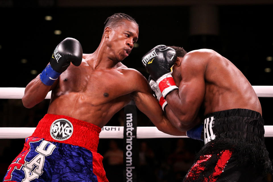 Patrick Day, left, lands a punch in the fatal bout against Charles Conwell on Saturday. (Photo: Dylan Buell via Getty Images)