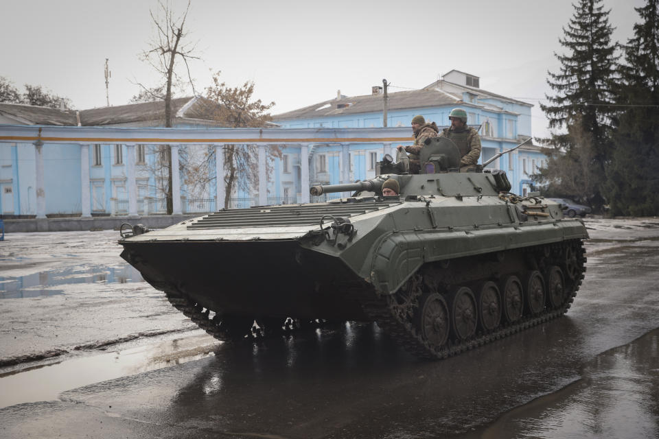 A Ukrainian armoured personnel carrier rides in Chasiv Yar, the site of the heaviest battles with the Russian troops, Donetsk region, Ukraine, Monday, Feb. 27, 2023. (AP Photo/Yevhen Titov)