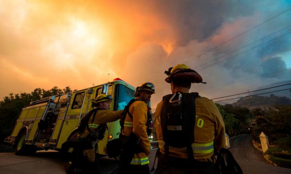 Firefighters monitor the advance of smoke and flames from the Thomas fire in 2017.