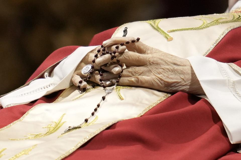 The body of Pope Emeritus Benedict XVI lies in state at St. Peter's Basilica on Monday.