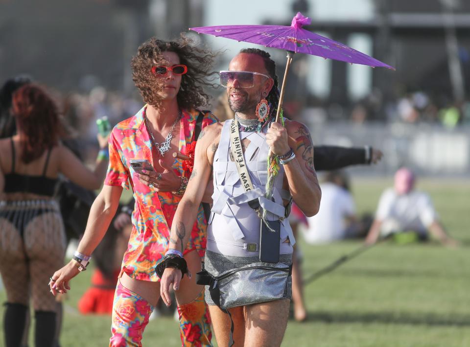 Festivalgoers walk the grounds at the Coachella Valley Music and Arts Festival in Indio, Calif., April  16, 2022.