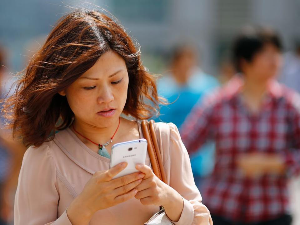 Some wireless customers who pay their bill via a credit card could soon see an extra surcharge every month, if the CRTC approves a proposal by one of Canada's biggest telecom providers. (Carlos Barria/Reuters - image credit)