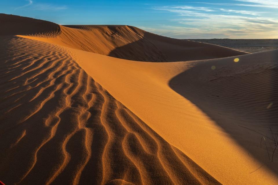 <p>Golden hour hits the smooth dunes near Birdsville, Queensland.</p>