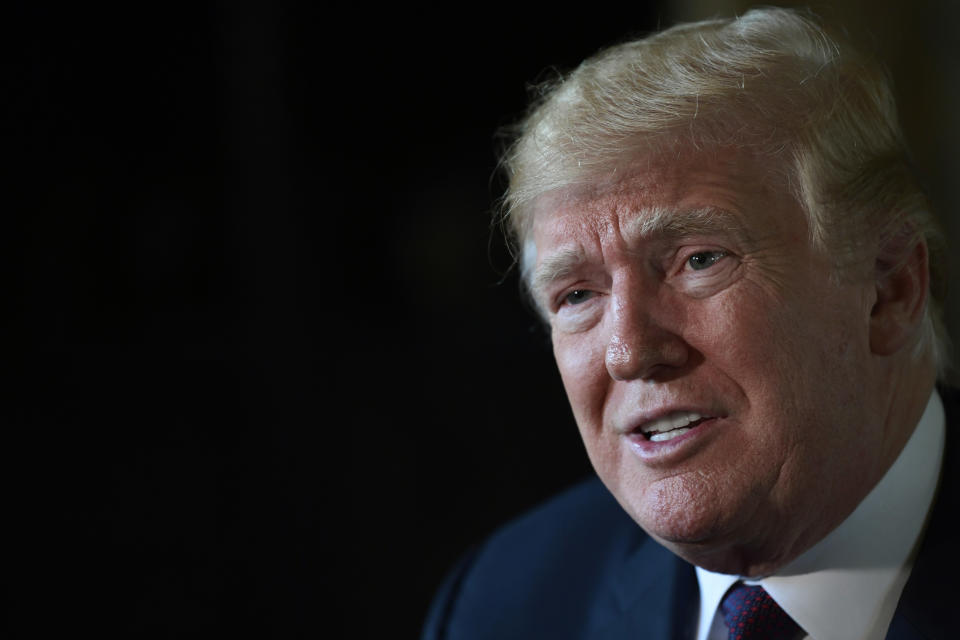 President Donald Trump speaks to reporters following his teleconference with troops from his Mar-a-Lago estate in Palm Beach, Fla., Thursday, Nov. 22, 2018. (AP Photo/Susan Walsh)