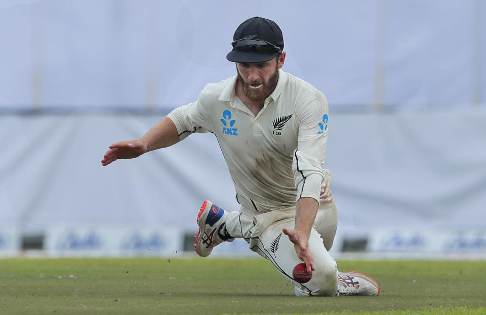 New Zealand's captain Kane Williamson fields a ball during the fourth day of the first test cricket match between Sri Lanka and New Zealand in Galle, Sri Lanka, Saturday, Aug. 17, 2019. (AP Photo/Eranga Jayawardena)