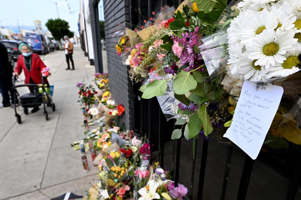 Flowers tacked onto the front of a business