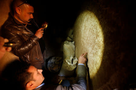 Archaeologist Musab Mohammed Jassim shows artefacts and archaeological pieces in a tunnel network running under the Mosque of Prophet Jonah, Nabi Yunus in Arabic, in eastern Mosul, Iraq March 9, 2017. Picture taken March 9, 2017. REUTERS/Suhaib Salem
