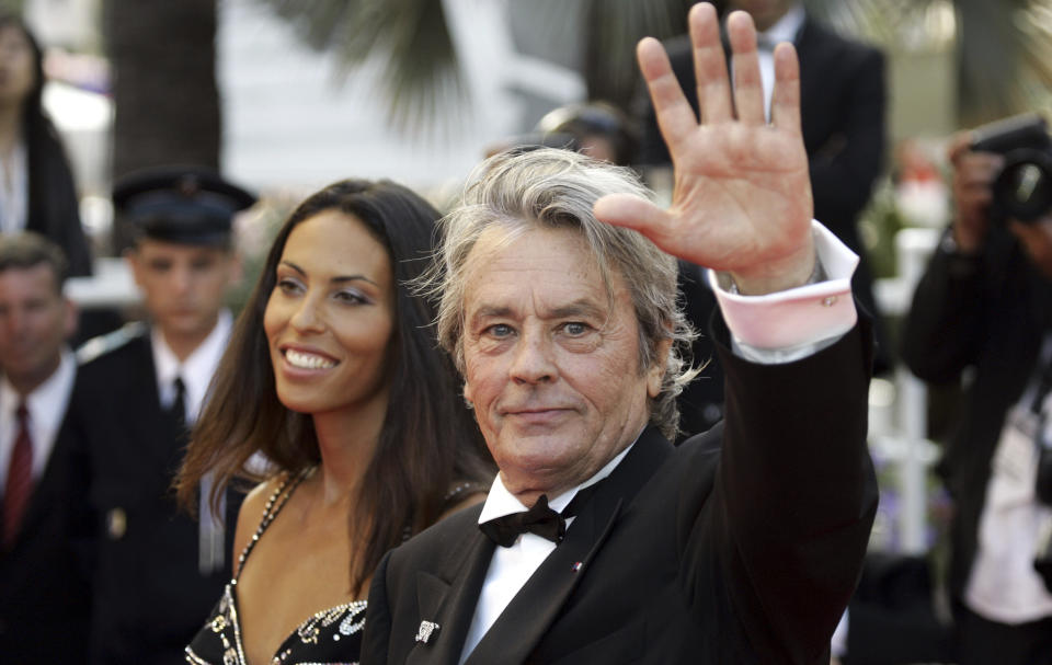 <p>FILE - French actor Alain Delon and model Bianca di Sofia arrive for the screening of the film "Chacun Son Cinema" ("To Each His Own Cinema"), at the 60th International film festival in Cannes, southern France, on Sunday, May 20, 2007. Alain Delon, the internationally acclaimed French actor who embodied both the bad guy and the policeman and made hearts throb around the world, has died at age 88, French media reported. (AP Photo/Andrew Medichini)</p>
