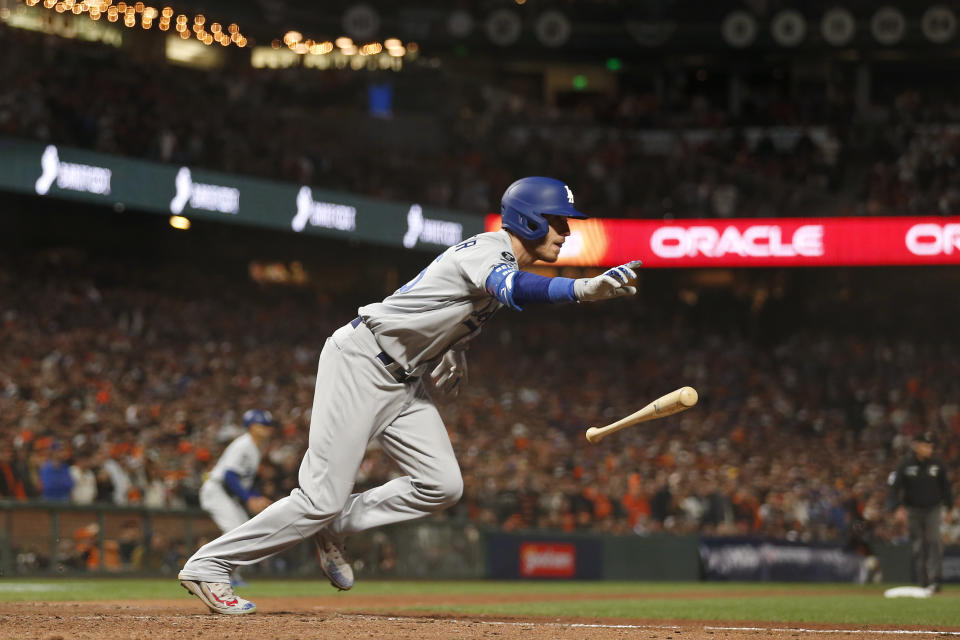 Los Angeles Dodgers' Cody Bellinger runs to first base after hitting an RBI-single against the San Francisco Giants during the ninth inning of Game 5 of a baseball National League Division Series Thursday, Oct. 14, 2021, in San Francisco. (AP Photo/Jed Jacobsohn)