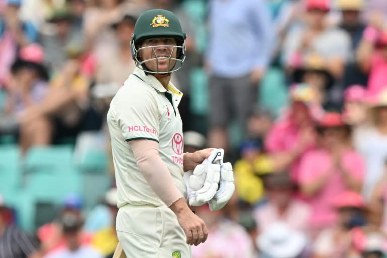 David Warner walks off the field after his dismissal (Saeed KHAN)