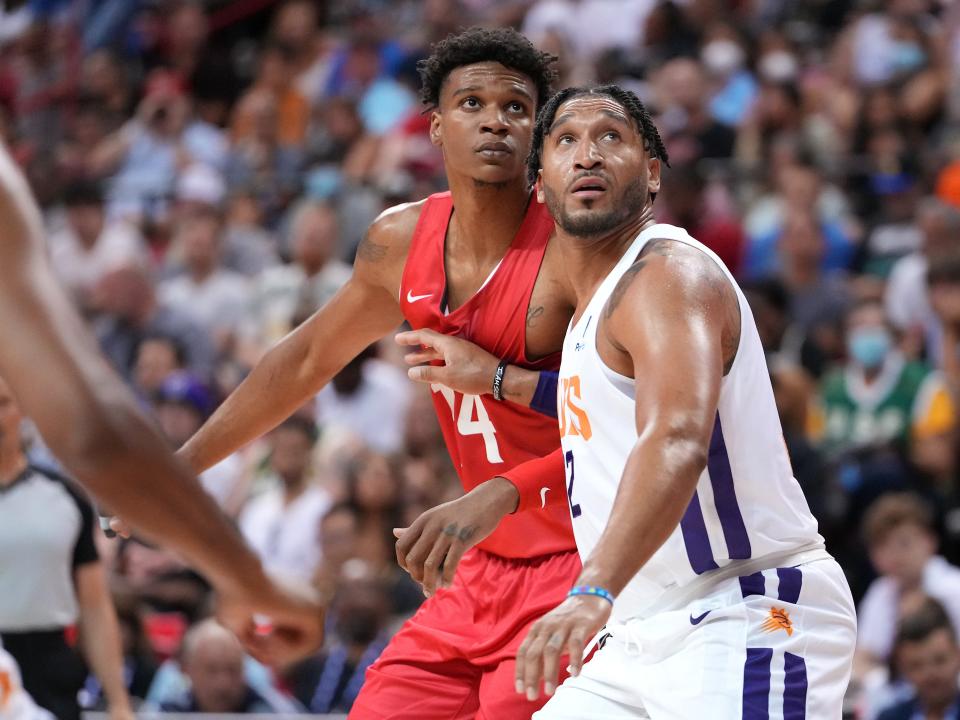 Phoenix Suns forward Ish Wainright (12) blocks out Washington Wizards forward Isaiah Todd (14) during an NBA Summer League game at Thomas & Mack Center.