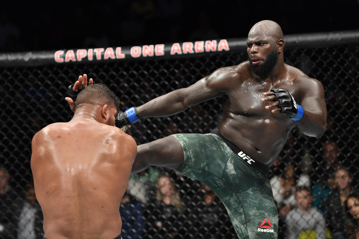 WASHINGTON, DC - DECEMBER 07: (R-L) Jairzinho Rozenstruik of Suriname kicks Alistair Overeem of Netherlands in their heavyweight bout during the UFC Fight Night event at Capital One Arena on December 07, 2019 in Washington, DC. (Photo by Jeff Bottari/Zuffa LLC via Getty Images)