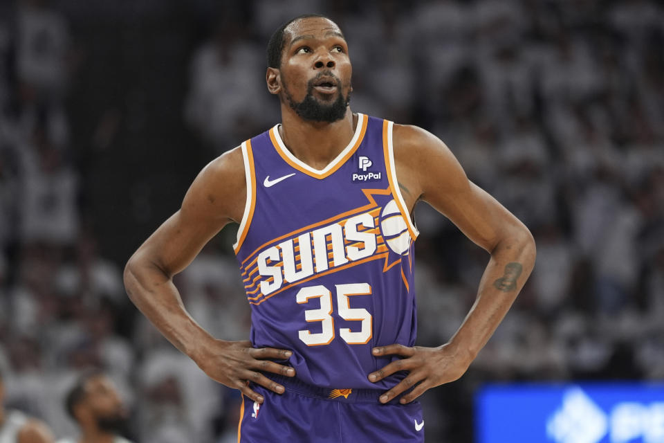 Phoenix Suns forward Kevin Durant (35) walks across the court during the first half of Game 2 of an NBA basketball first-round playoff series against the Minnesota Timberwolves, Tuesday, April 23, 2024, in Minneapolis. (AP Photo/Abbie Parr)