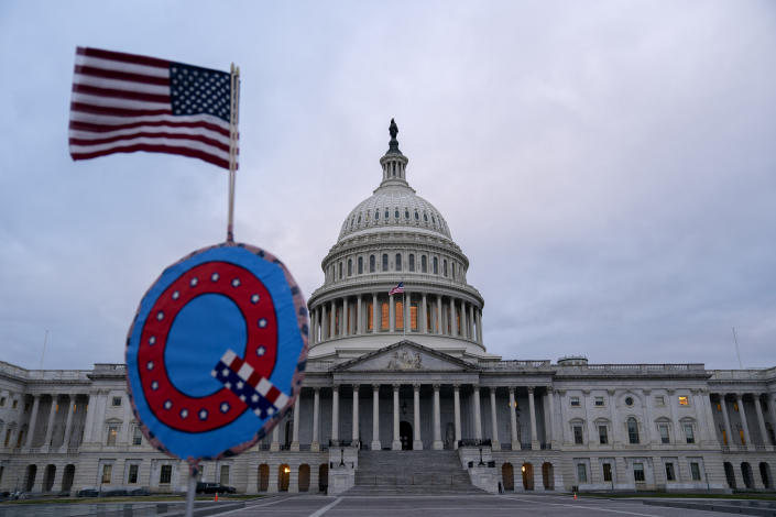 A demonstrator holds a &quot;Q&quot; sign outside the U.S. Capitol in Washington on Wednesday, Jan. 6, 2021. (Stefani Reynolds/Bloomberg via Getty Images)