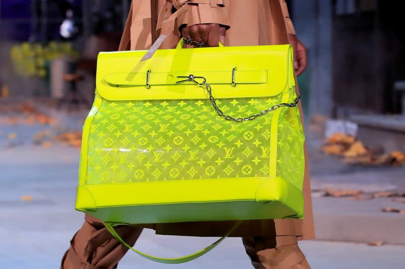 FILE PHOTO: FILE PHOTO: A model presents a bag creation by designer Virgil Abloh during a preview show for his Fall/Winter 2019-2020 collection for fashion house Louis Vuitton during Men's Fashion Week in Paris